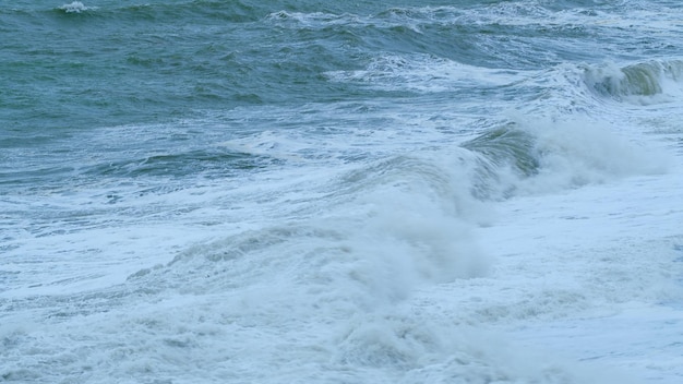 Global warming beautiful dark ocean wave crashing with splashes static