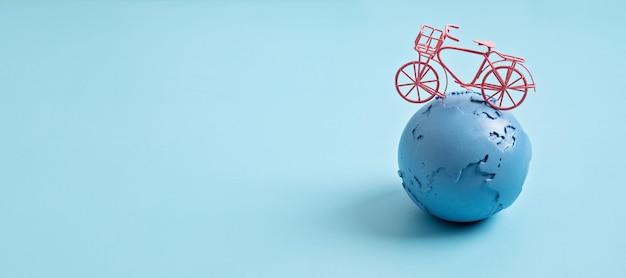 Globe and bicycle save the planet idea international earth day\
world bicycle day