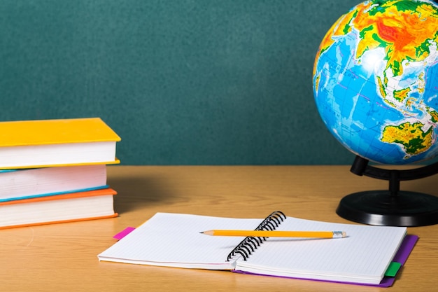 Globe of the earth planet on school table background