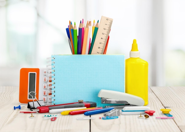 Globe, notebook stack and pencils. Schoolchild and student studies accessories.