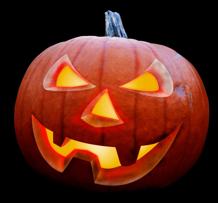 Foto gloeiende halloween pompoen geïsoleerd op zwarte achtergrond halloween concept