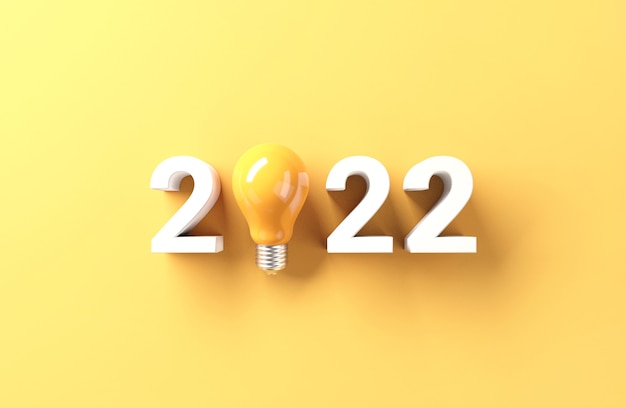 Gloeilampenidee met het nieuwe jaar van 2022 op gele achtergrond