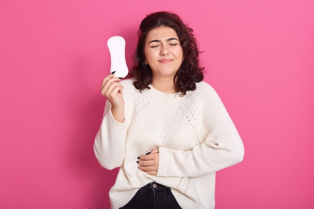 Gloomy Caucasian woman cares about personal hygiene