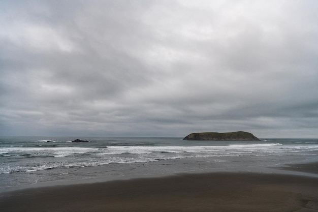 Gloomy weather with sea or ocean wavy water and cloudy sky, weather.