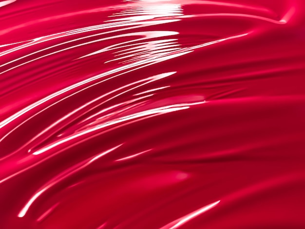 뷰티 메이크업 제품 배경 스킨케어 화장품 및 고급 메이크업 브랜드 디자인으로 광택 있는 빨간색 화장품 질감