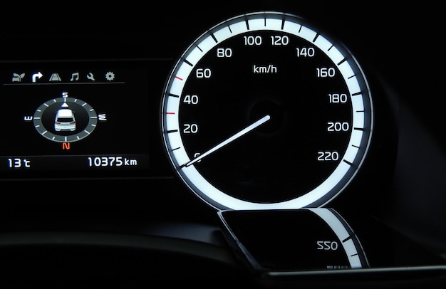 Glossy surface of smartphone on a car dashboard