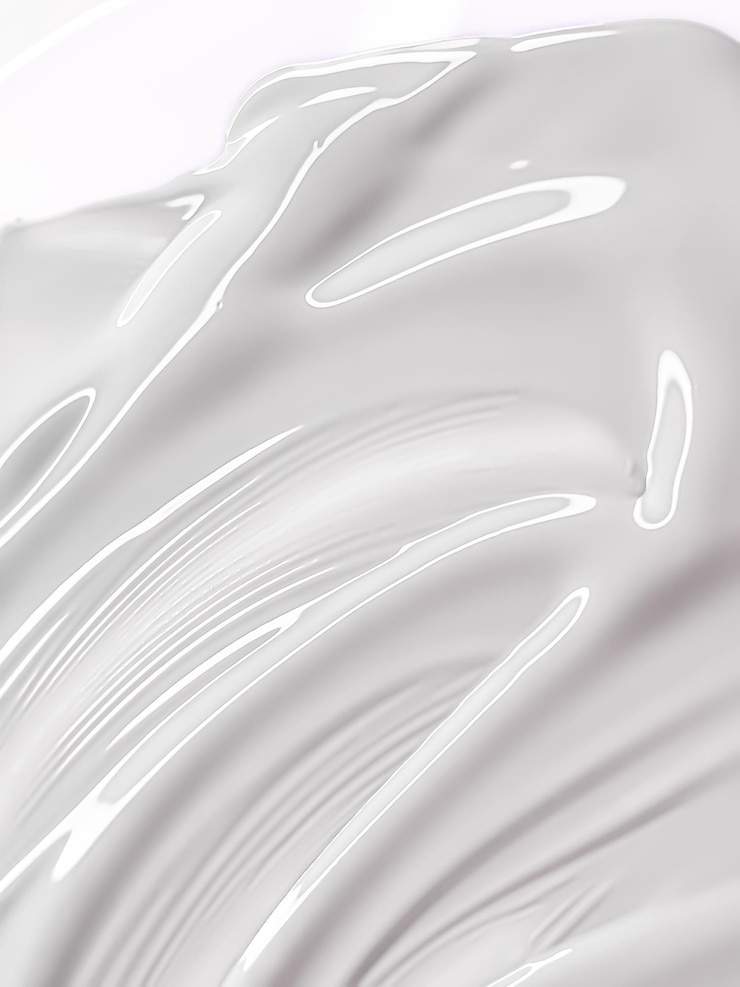 Photo glossy white cosmetic texture as beauty makeup product background cosmetics and luxury makeup brand design