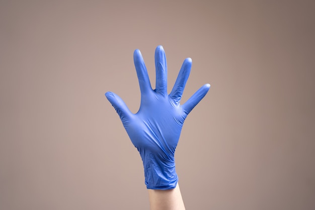 Gloved hand.