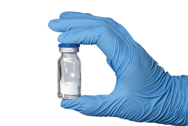 Gloved medic's hand with powder vaccine vial