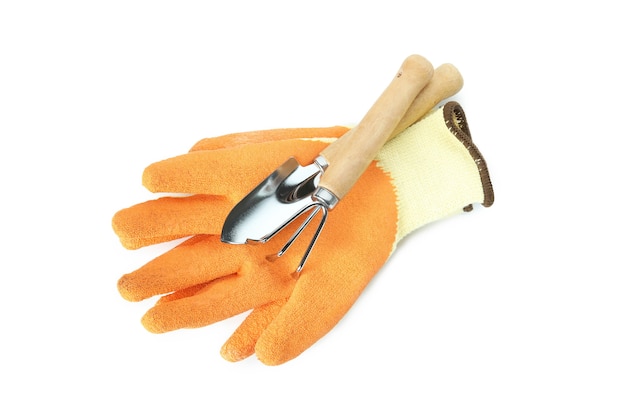 Gloves and gardening tools isolated on white background