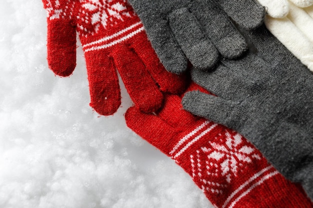 Gloves on a white background Snowy background Close up COPY SPACE