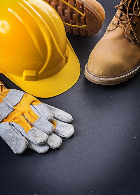 Photo gloves yellow helmet working boots