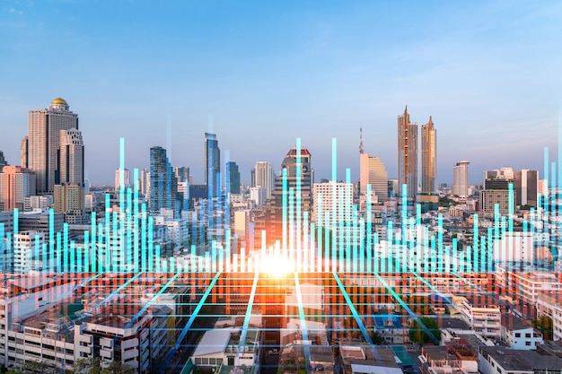 Glowing forex graph hologram aerial panoramic cityscape of\
bangkok at sunset stock and bond trading in asia the concept of\
fund management double exposure