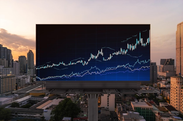 Glowing FOREX graph hologram on billboard aerial panoramic cityscape of Bangkok at sunset Stock and bond trading in Southeast Asia The concept of fund management