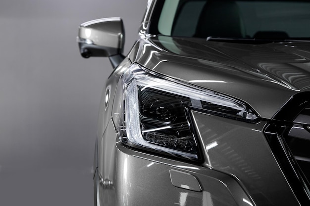 Glowing Headlight of a modern car close-up