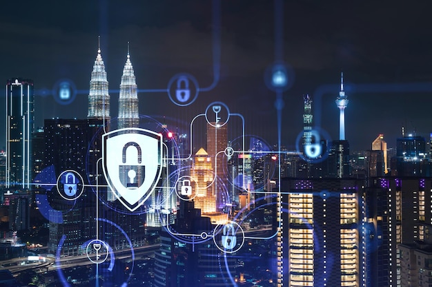 Glowing padlock hologram night panoramic city view of kuala\
lumpur malaysia asia the concept of cyber security shields to\
protect kl companies double exposure