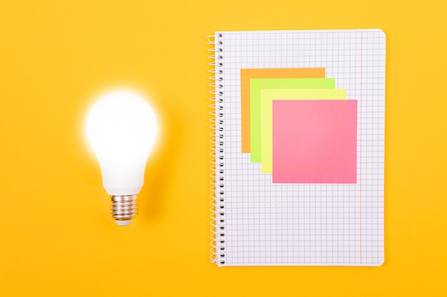 Glowing power saving lamp and a notepad with sticky notes