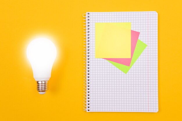 Glowing power saving lamp and a notepad with sticky notes