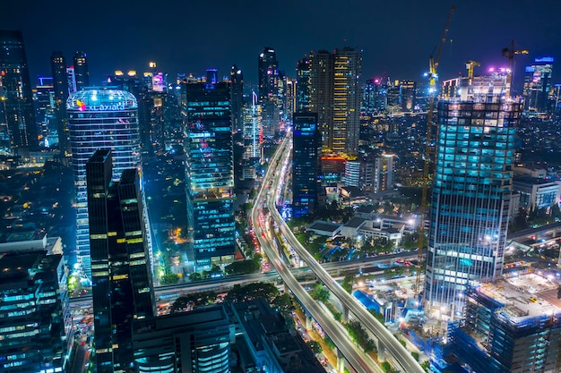 Glowing skyscrapers in the middle of construction