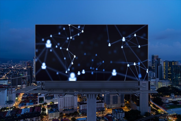 Glowing social media icons on billboard over night panoramic\
city view of kuala lumpur malaysia asia the concept of networking\
and establishing new connections between people and businesses in\
kl