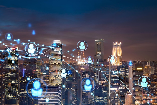 Glowing Social media icons on night panoramic city view of Singapore Asia The concept of networking and establishing new connections between people in businesses Double exposure