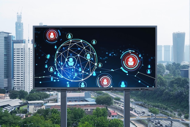 Glowing Social media icons on road billboard over panoramic city view of Kuala Lumpur Malaysia Asia The concept of networking and establishing new connections between people and businesses in KL