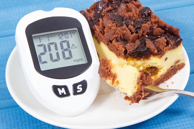 Glucometer for checking sugar level and fresh baked cheesecake Diabetes and dieting during diabetes