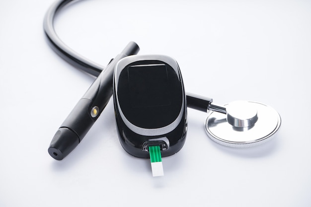 Photo glucometer and lancet pen, stethoscope isolated