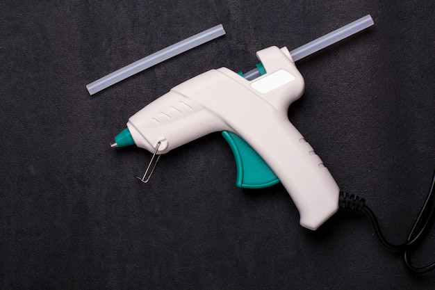 Glue-gun on the black surface