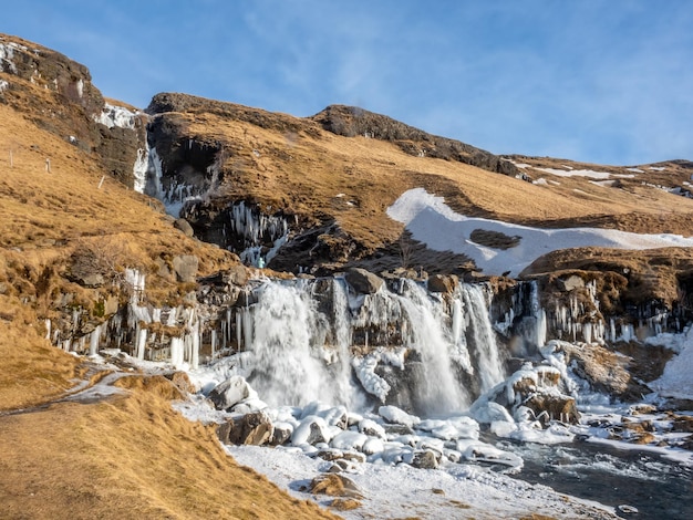 Gluggafoss large waterfall in winter season under blue sky in Iceland