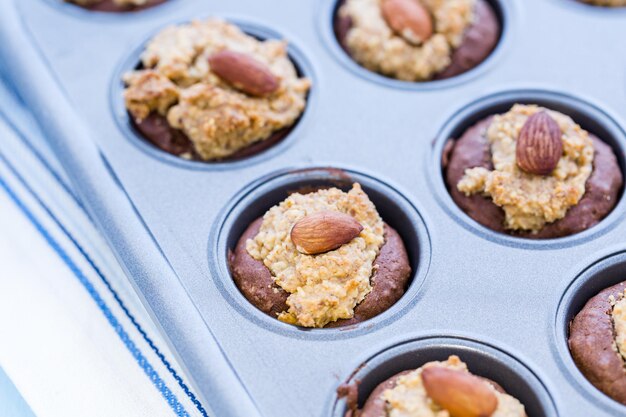 Gluten free chocolate baked snacks with peanut butter and whole almond.