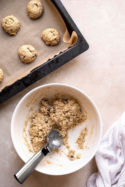 Gluten free raw, uncooked banana cookies with chocolate chips. Healthy homemade biscuits, top view.