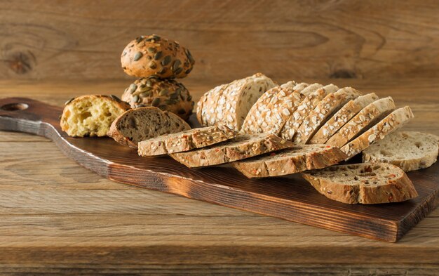 Gluten-free vegan bread and no animal products. Vegetarian bread with oatmeal a wooden rustic table
