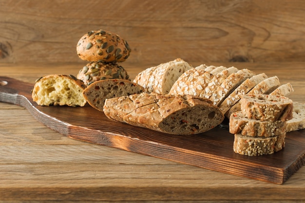 Gluten-free vegan bread and no animal products. Vegetarian bread with oatmeal on a wooden table