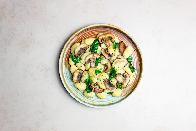 Gnocchi in a creamy sauce with mushrooms and spinach Healthy eating Vegetarian food