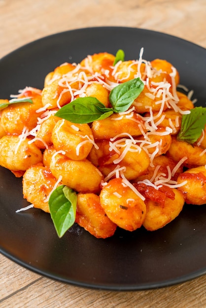 Gnocchi in tomato sauce with cheese