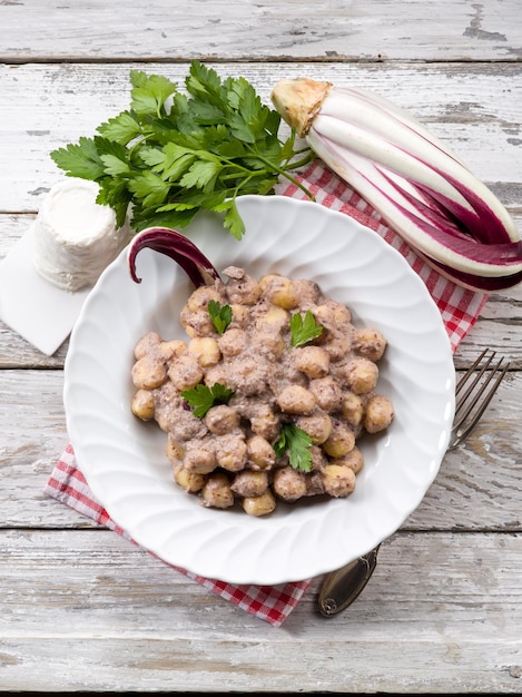 Gnocchi with chicory and ricotta sauce