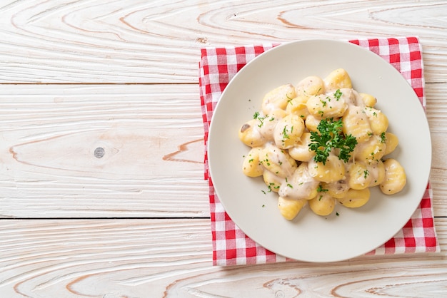 Gnocchi with mushroom cream sauce and cheese - Italian food style