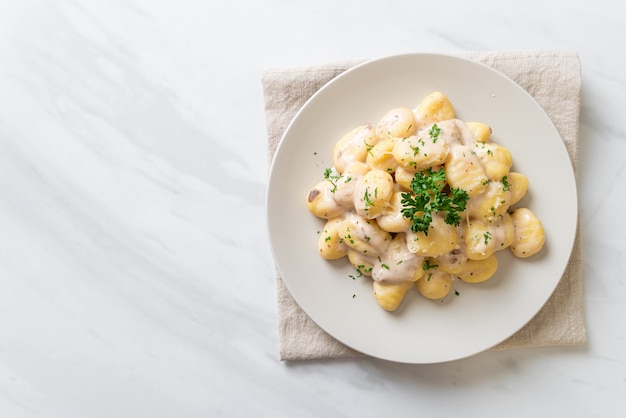 Gnocchi with mushroom cream sauce and cheese