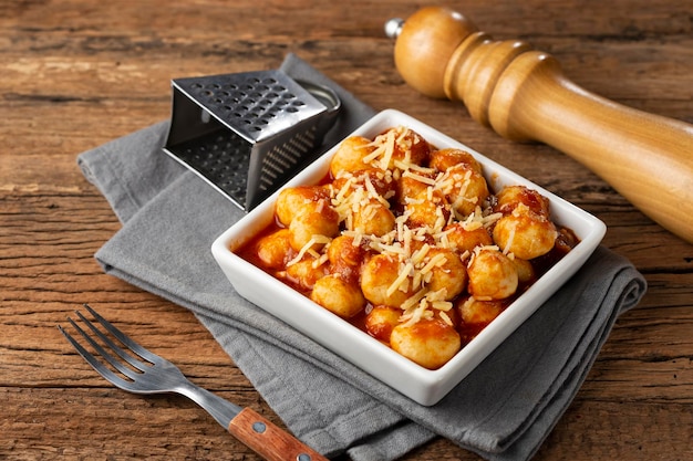 Gnocchi with tomato sauce and grated Parmesan cheese