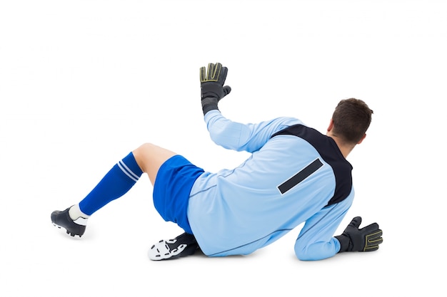 Photo goalkeeper in blue making a save