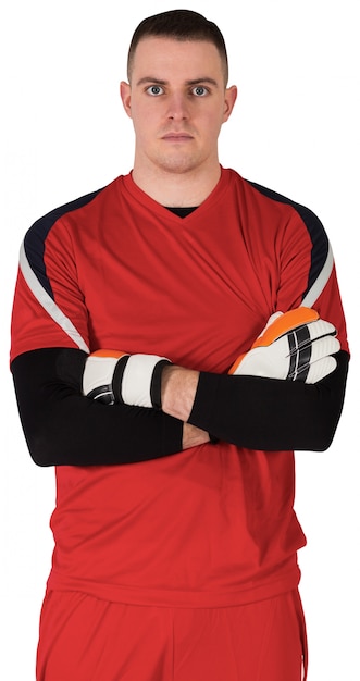 Goalkeeper in red looking at camera