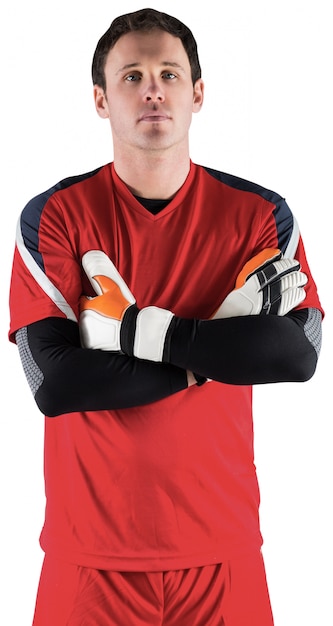 Goalkeeper in red looking at camera