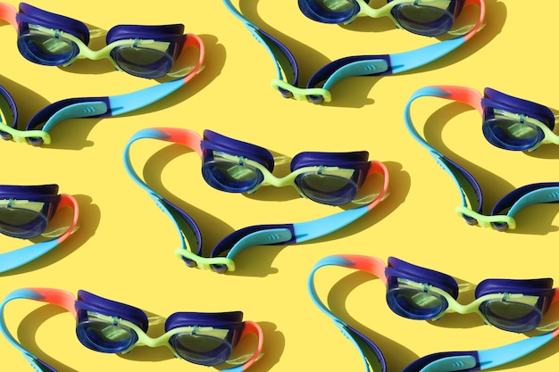 Goggles for swimming on a yellow background