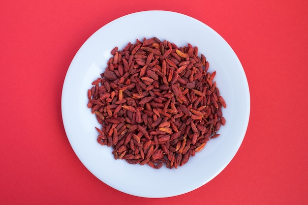 Goji berries in the white plate.Top view.