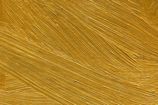 Gold acrylic texture painted on cardboard paper background