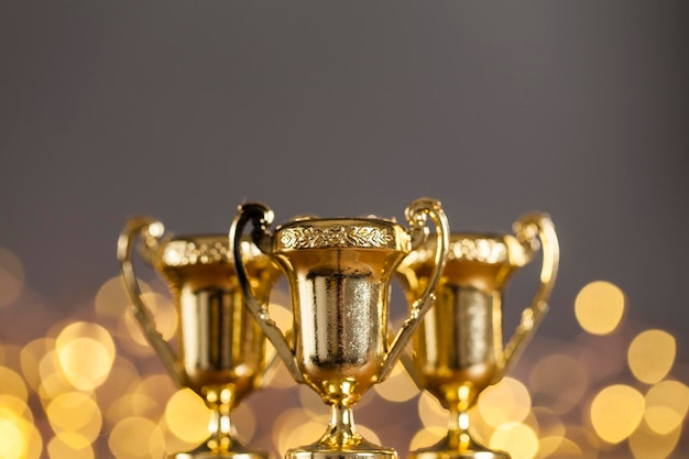 Gold award trophy against bright blurred lights