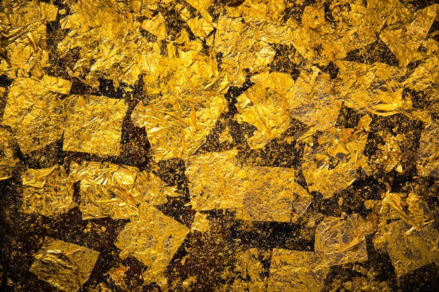gold background made of rough textured backdrop gold leaf