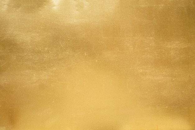 写真 ゴールドの背景色またはテクスチャとグラデーションの影。