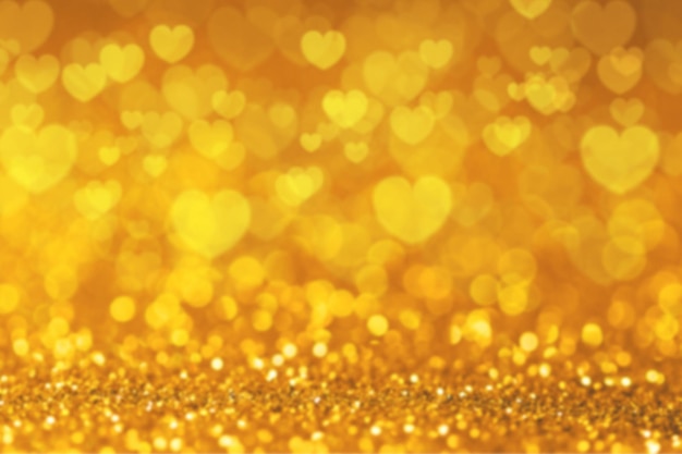 ハートの形をしたゴールドの背景。バレンタインデーの背景